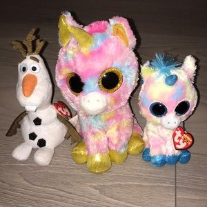 Three beanie boos (Two unicorns and one Olaf)